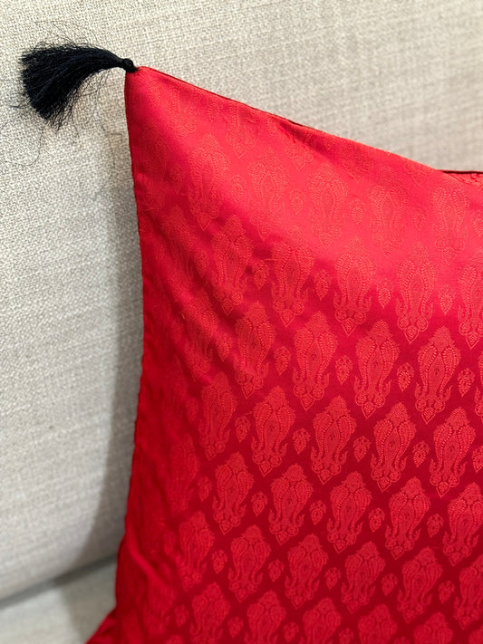 toamto red silk cusion cover with black tassels