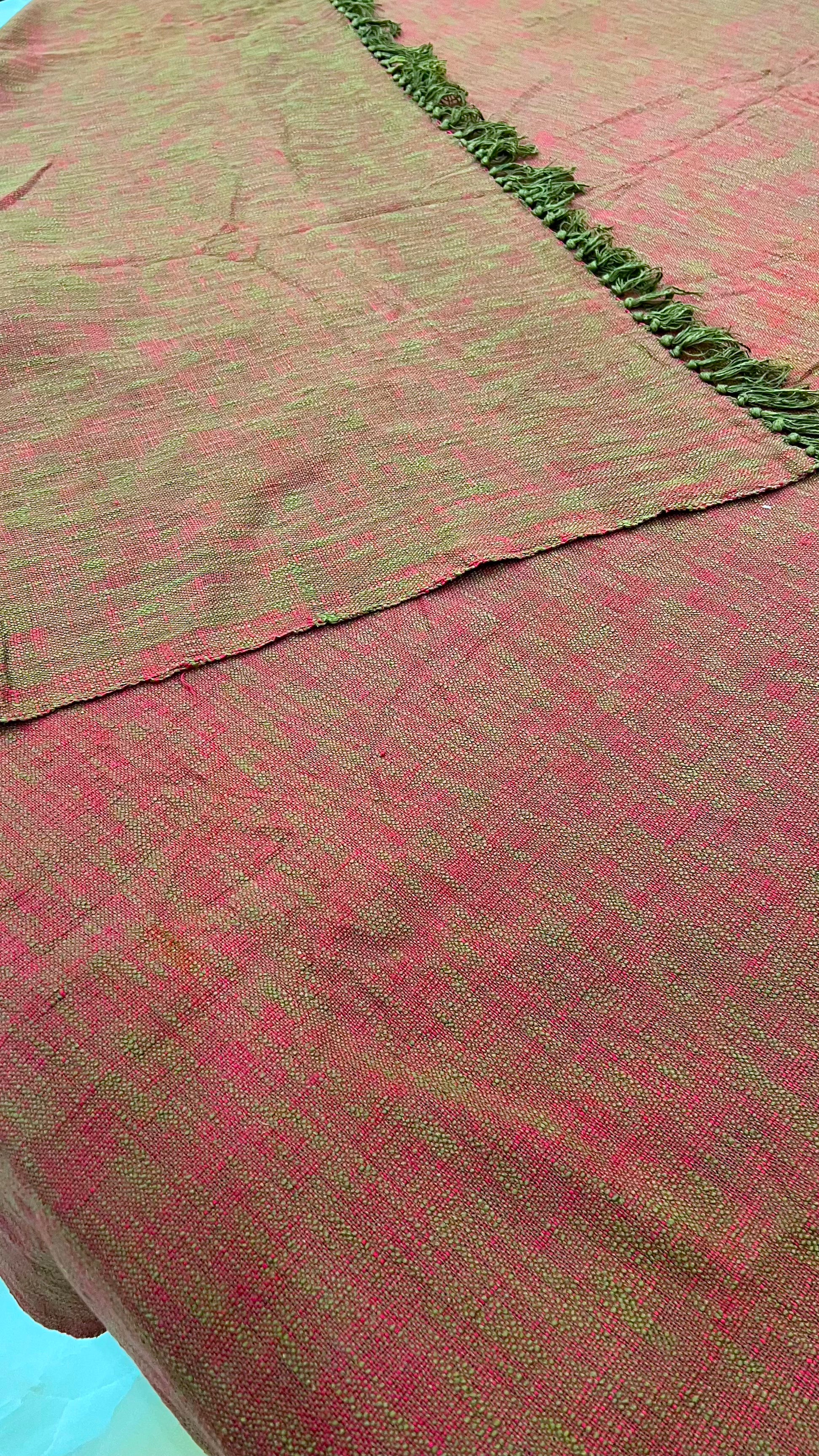 rust and orange double bed cover in king size with green tassel