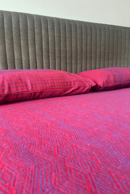 pink double bedcover with pillow