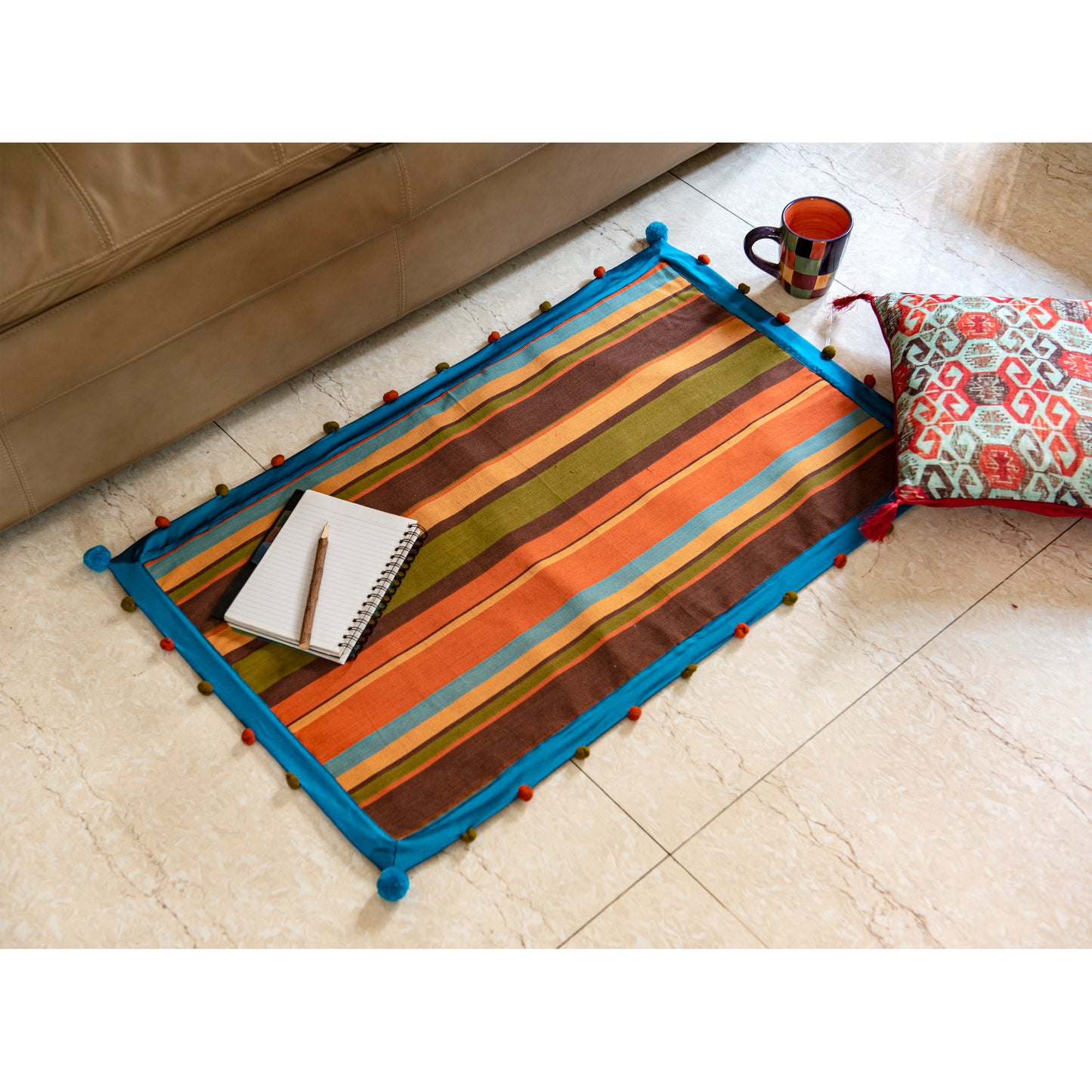 colourful-rug-with-pom-poms